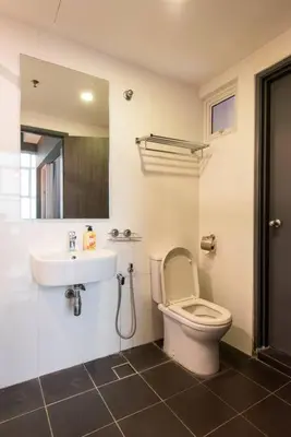 a bathroom with a toilet and a sink at Karaoke,XBox,Foosball,Billiard,Air Hockey,Ping Pong & Board Games in George Town