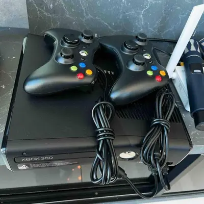 two video game controllers sitting on top of a box at XBox, Karaoke, Foosball, PoolTable, IceHockey, Ping Pong, Board Games in George Town