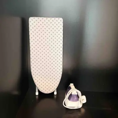 a white vase sitting on a table next to a shoe at XBox, Karaoke, Foosball, PoolTable, IceHockey, Ping Pong, Board Games in George Town