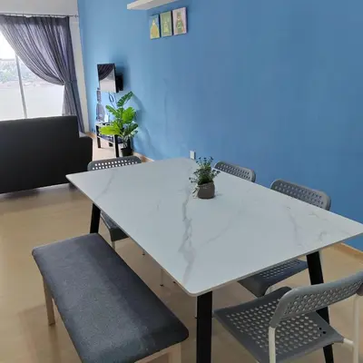 a white table and chairs in a room at Muji Style brick themed Cameron Highland Homestay FREE Netflix in Tanah Rata