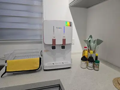 a kitchen counter with a mixer on a counter top at Vanilla Cottage - Urban Suites by Ocean Luxe in Jelutong