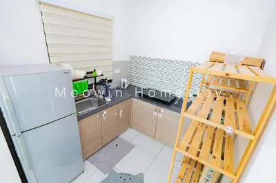 a kitchen with a ladder next to a refrigerator at Cozy&Comfy Suite Room Perai in Perai
