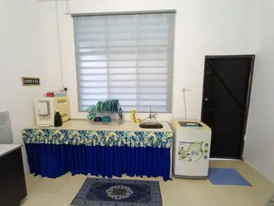 a kitchen with a counter with a sink and a window at Home MH Casa Damai Private Pool at Sungai Petani in Sungai Petani