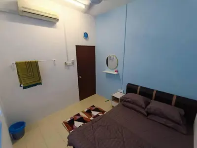 a bedroom with a bed and a mirror on the wall at Home MH Casa Damai Private Pool at Sungai Petani in Sungai Petani