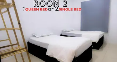 two beds in a room with a ladder at Ipoh Water Park(14pax) Homestay@HopeStay in Ipoh