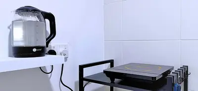 a blender sitting on a shelf next to a table at Ipoh Water Park(14pax) Homestay@HopeStay in Ipoh