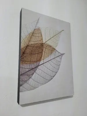 a picture of a leaf on a wall at Pangkor BeachWalk Studio in Pangkor