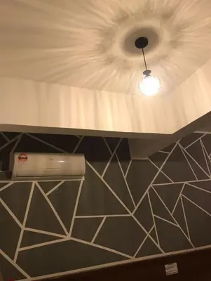 a ceiling with a light in a room at Pangkor BeachWalk Studio in Pangkor