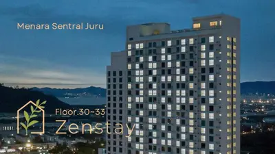 a tall building with a sign on the side of it at Zenstay Abnb Perai Penang in Bukit Mertajam