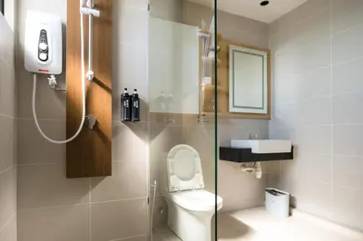 a bathroom with a toilet and a sink at Zenstay Abnb Perai Penang in Bukit Mertajam