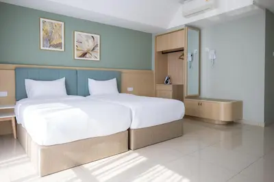 a bedroom with a large bed and a bathroom at Zenstay Abnb Perai Penang in Bukit Mertajam