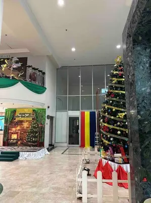 a large christmas tree in a store with at Rainbow Paradise Homestay @ Tanjung Bungah by Landmark in Tanjung Bungah