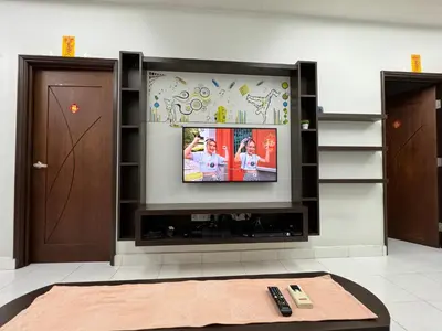 a living room with a flat screen tv on a wall at Cozy House 37 @ Alma BM in Bukit Mertajam