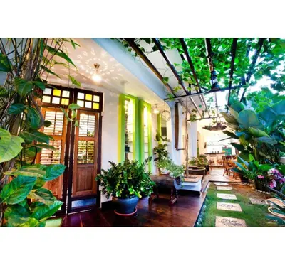 a room filled with lots of plants at Hotel O Vince Villa in Bukit Mertajam