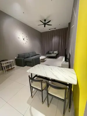 a living room with a table and a couch at Penang Georgetown KT Home for 8 pax in George Town