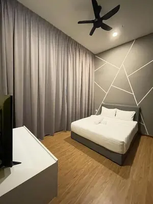 a bedroom with a bed and a ceiling fan at Penang Georgetown KT Home for 8 pax in George Town