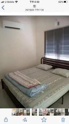 a picture of a bed in a room with a window at Batu Kawan HS in Simpang Ampat