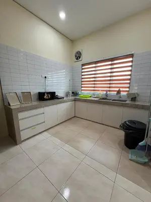 a large kitchen with a sink and a window at The Five Cottage @ Botani Ipoh in Ipoh