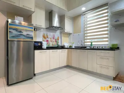 a kitchen with a stainless steel refrigerator at Ipoh Meru Casa Kayangan 3 Bedroom Apartment in Ipoh