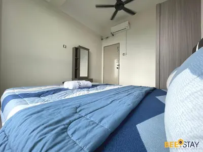 a large blue bed in a room with a ceiling at Ipoh Meru Casa Kayangan 3 Bedroom Apartment in Ipoh