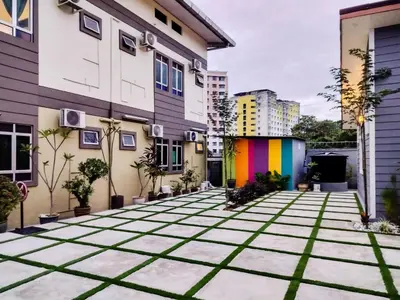 a courtyard of a building with a rainbow at Hidden 4BR Cottage House Retreats (Free Parking) in Butterworth