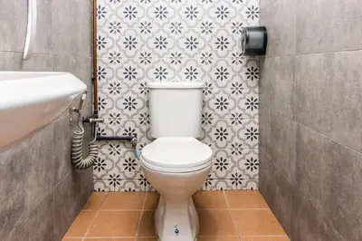 a bathroom with a toilet and a sink at Hidden 4BR Cottage House Retreats (Free Parking) in Butterworth