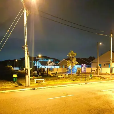 an empty street at night with a street light at Mountain View Umoh50 Ipoh End-Lot Wi-fi Cozy in Ipoh