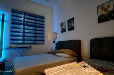 a bedroom with a bed and a window with a mirror at Mountain View Umoh50 Ipoh End-Lot Wi-fi Cozy in Ipoh