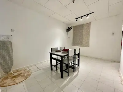 a dining room with a table and chairs in a room at Cozy39#6pax#netflix#jpnstyle#NearAlma#5kmtoIconCity#BM in Bukit Mertajam