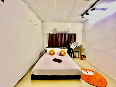 a bedroom with a bed with two teddy bears on it at Cozy39#6pax#netflix#jpnstyle#NearAlma#5kmtoIconCity#BM in Bukit Mertajam