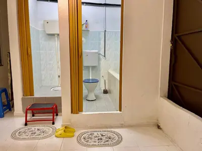a bathroom with a shower and a toilet in it at Cozy39#6pax#netflix#jpnstyle#NearAlma#5kmtoIconCity#BM in Bukit Mertajam