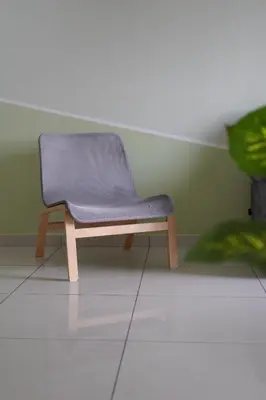 a purple chair in a room with a green wall at The Horizon Ipoh L15 by Grab A Stay in Ipoh