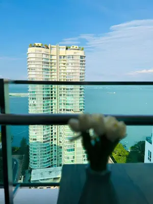 a vase with a flower in front of a building at Mansion One l 7pax 2R2B l Seaview l Gleneagle l by PerfectSweetHome in George Town