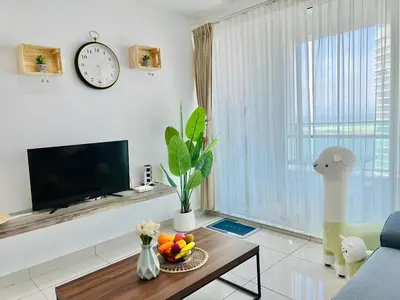 a living room with a tv and a table at Mansion One l 7pax 2R2B l Seaview l Gleneagle l by PerfectSweetHome in George Town