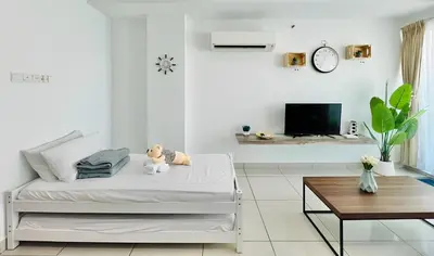 a white room with a bed with a teddy bear on it at Mansion One l 7pax 2R2B l Seaview l Gleneagle l by PerfectSweetHome in George Town