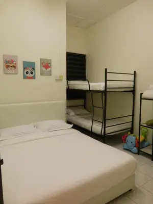 a bedroom with two bunk beds in a room at The Karaoke Homes Ipoh, Oldtown in Ipoh