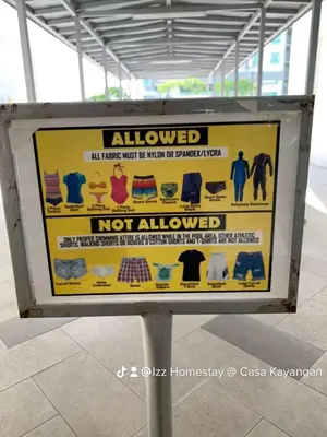 a yellow sign that says allowed not allowed at Eijaz Homestay @ Casa Kayangan in Ipoh