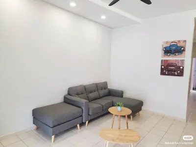 a living room with a couch and a table at Tmn seri botani ipoh greece 4br 14pax mahjong in Ipoh
