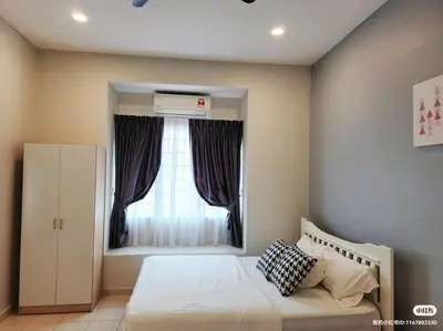 a bedroom with a large bed with a window at Tmn seri botani ipoh greece 4br 14pax mahjong in Ipoh