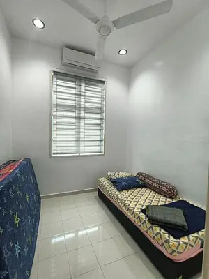a bedroom with two beds and a window at HOMESTAY BERTAM SAFAR in Kepala Batas