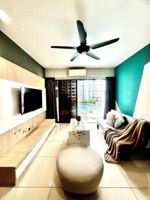 a living room with a ceiling fan and a couch at MyStay IPOH Manhattan waterpark in Ipoh