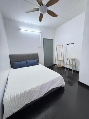 a bedroom with a bed with a ceiling fan at Decozy Ten Ipoh Bercham 13 pax Plus in Ipoh