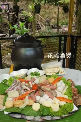 a plate of food with vegetables on a table at Fig Tree Hills Resort (\u82b1\u679c\u5c71\u5ea6\u5047\u6751) in Bayan Lepas