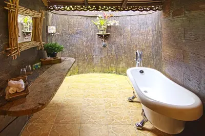 a bathroom with a bath tub and a sink at Fig Tree Hills Resort (\u82b1\u679c\u5c71\u5ea6\u5047\u6751) in Bayan Lepas