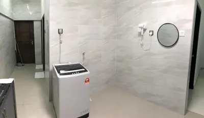 a bathroom with a shower with a mirror and a trash can at Modern 3 bedrooms House, Walking distance to Kulim Town by Mr Homestay in Kulim