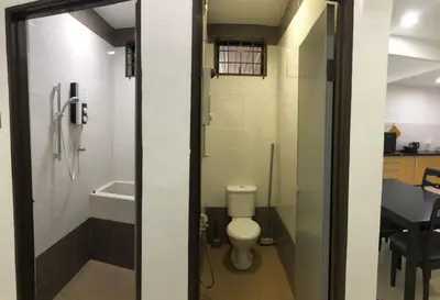 a small bathroom with a toilet and a shower at 4 Bedrooms Semi D Homestay by Mr Homestay in Kulim