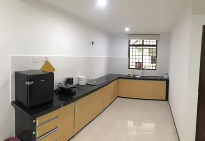 a kitchen with a black counter top in a room at 4 Bedrooms Semi D Homestay by Mr Homestay in Kulim