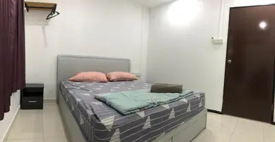 a bed with two pillows on it in a room at 4 Bedrooms Semi D Homestay by Mr Homestay in Kulim