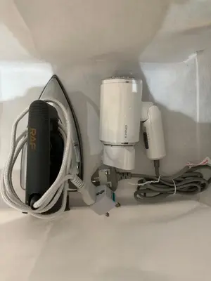 a camera and a cup in the corner of a wall at Cozy Scandinavi Guest room - Queen Bed, Free Netflix, Prime & Wi-Fi Near Bukit Mertajam in Kubang Semang