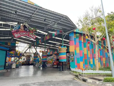 a colorful building with a kinks party sign on it at Delisha 2 Homestay 3R2B The Retreat Nova Kae Farm in Brinchang